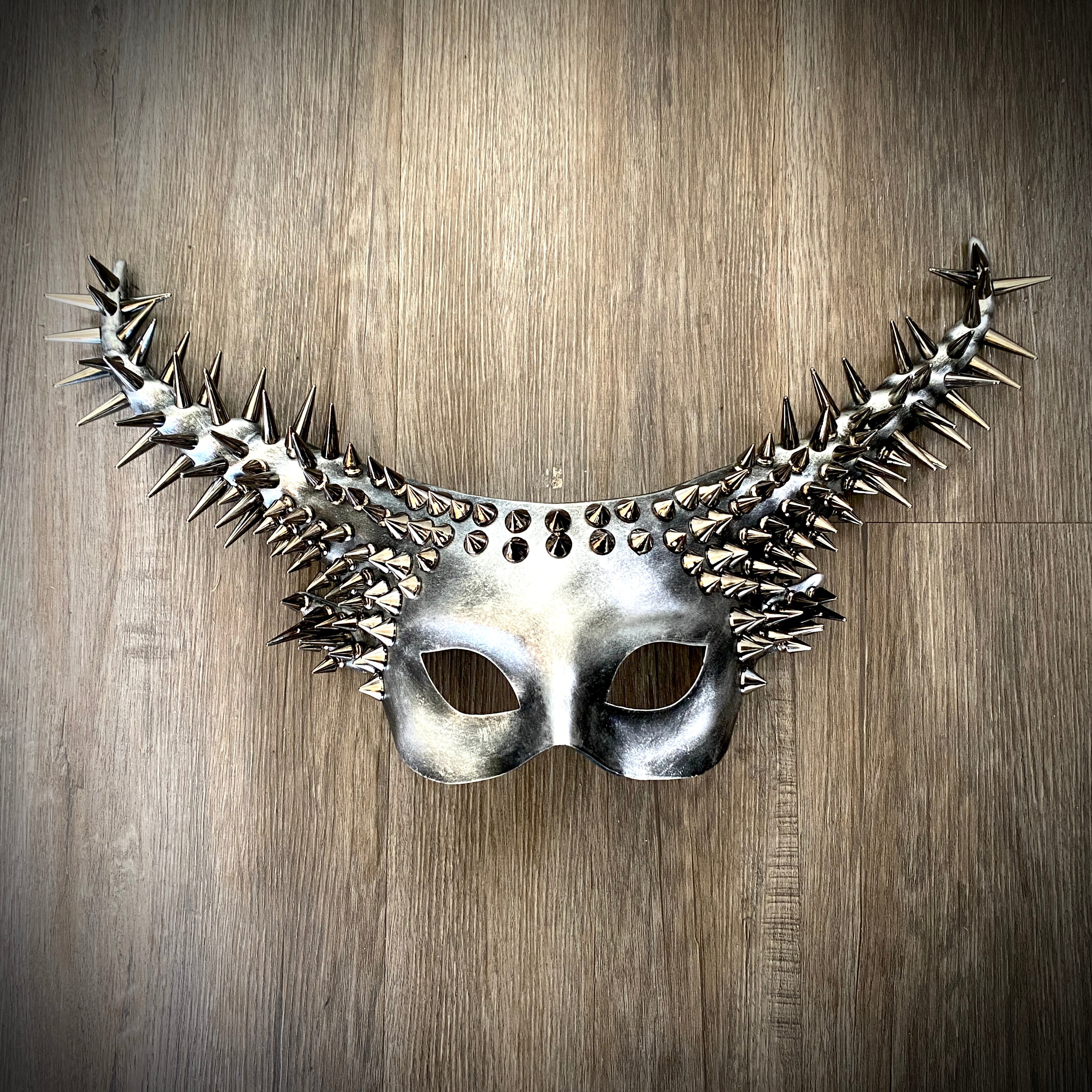 A metallic silver spike goat horn masquerade mask for women